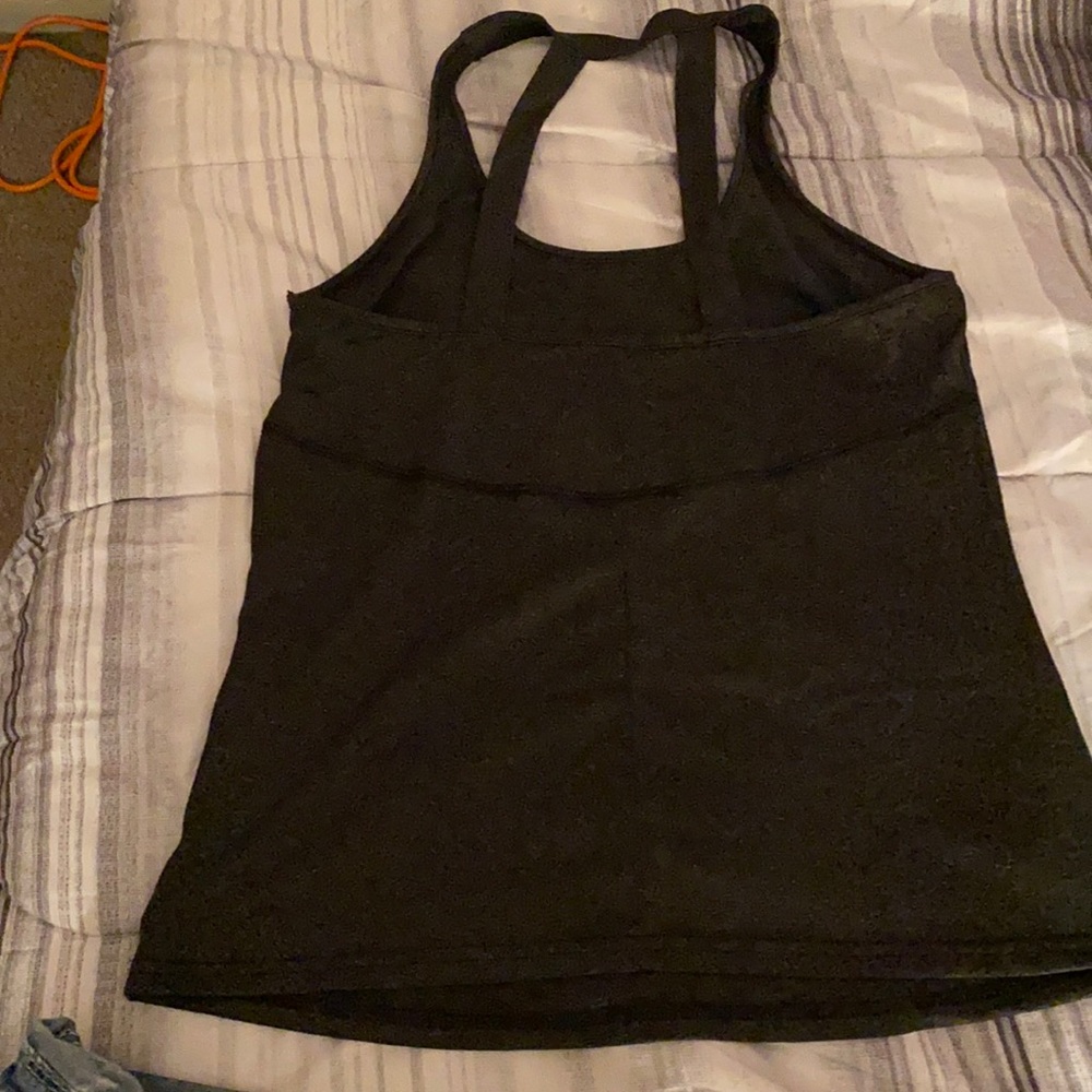 Black tank top size medium brand name Aceshin gray shape and brand new.